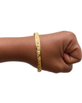 Single Stack Haus diamond-cut gold bangle worn on wrist