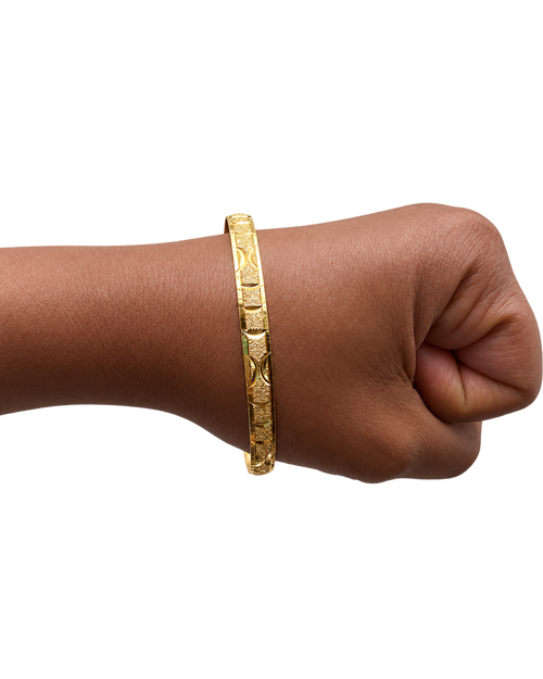 Single Stack Haus diamond-cut gold bangle worn on wrist