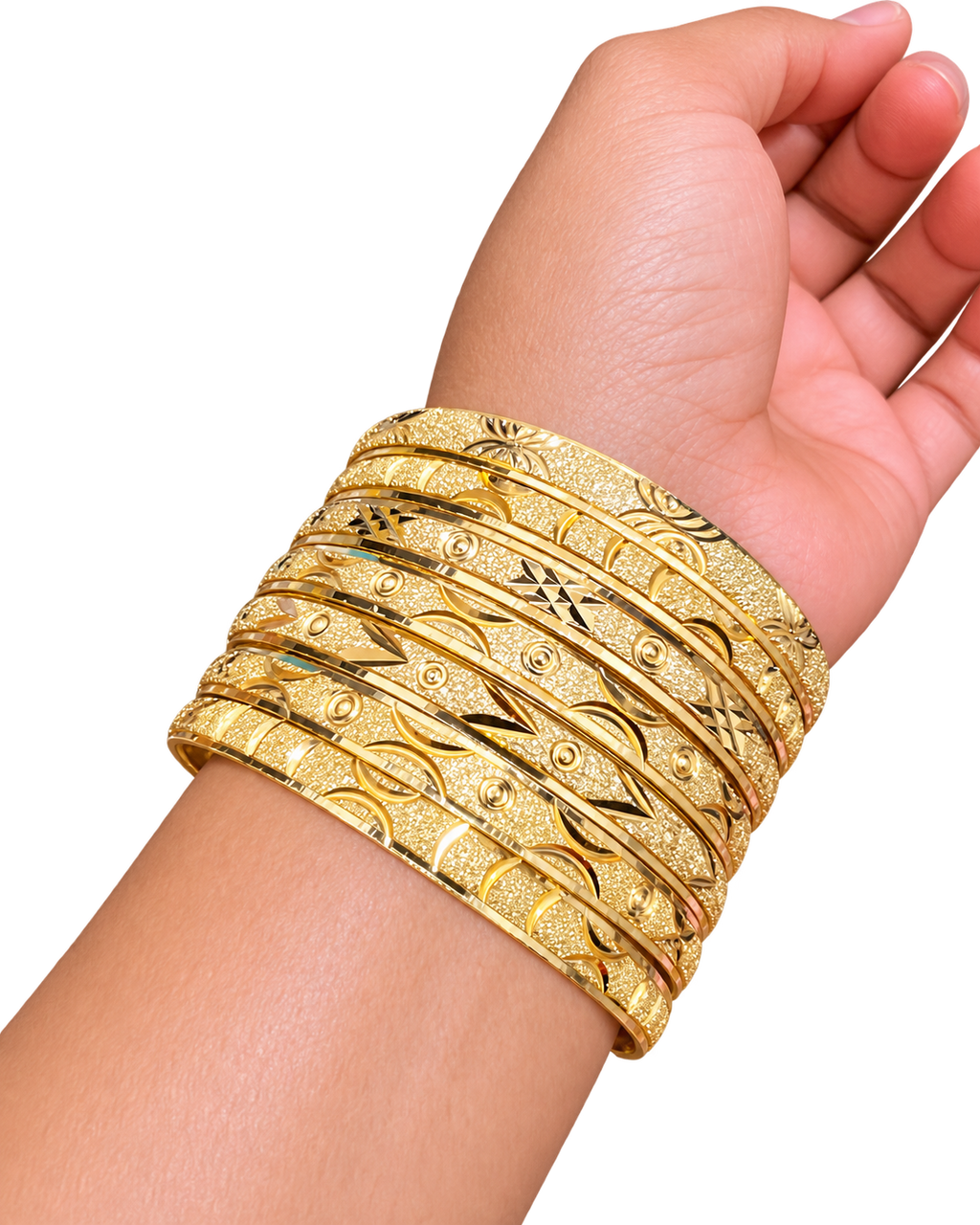Close-up of Stack Haus diamond-cut gold bangles stacked on wrist