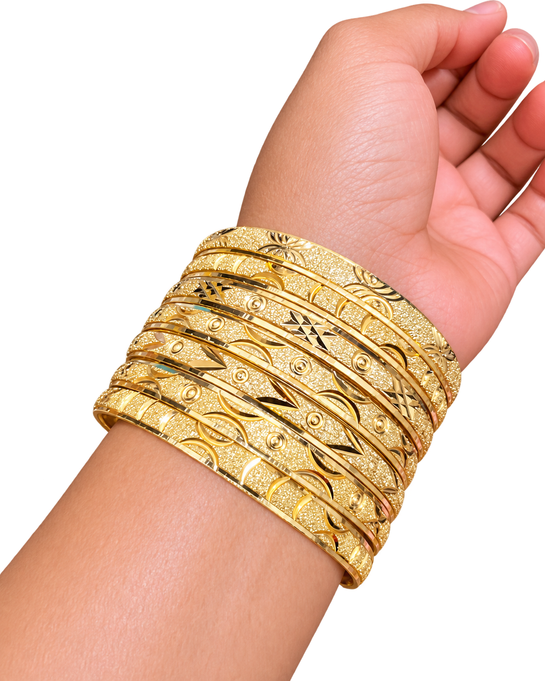 Close-up of Stack Haus diamond-cut gold bangles stacked on wrist