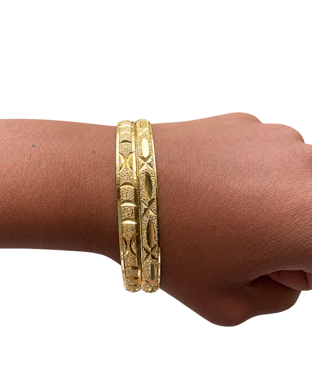 Two Stack Haus diamond-cut gold bangles worn together on wrist